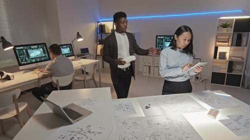 Engineers Collaborate on Future Car Design in Office