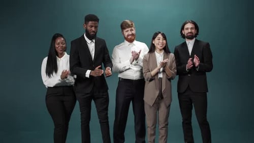 Best Coworkers are Standing and Applauding Looking at the Camera