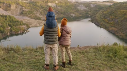 Family of Three Enjoying Scenic View