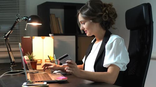 Woman Shopping Online With Laptop And Credit Card