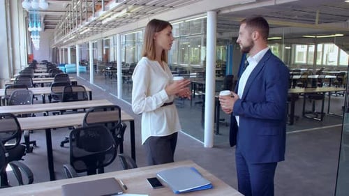 Business Professionals Discussing Work Over Coffee