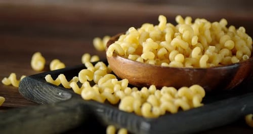Spiral Pasta in Wooden Bowl Close Up