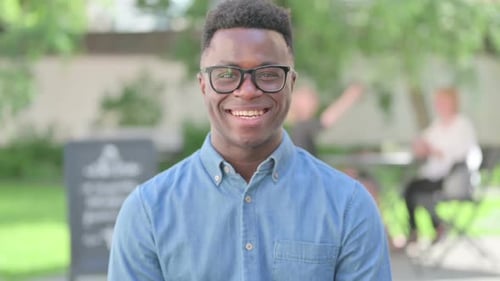 Young Man Smiling Outdoors Portrait