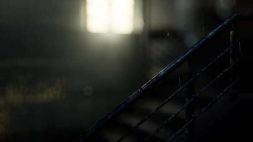 Rain Falling on Dark Industrial Railing