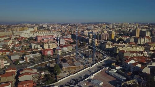 Urban Construction Site with Cranes from Above