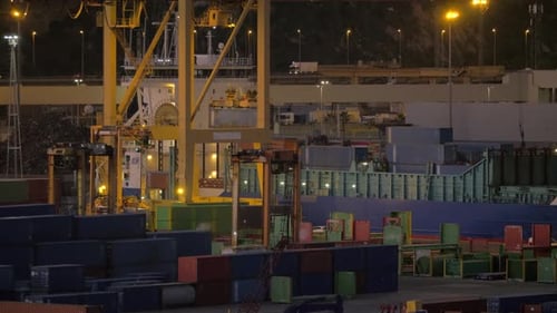 Container port with working crane and vehicles