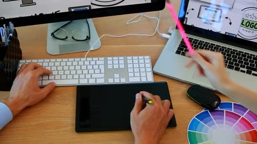 Graphic Designers Working at Computer on a Project