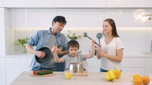 Family Enjoys Making Music Together in the Kitchen