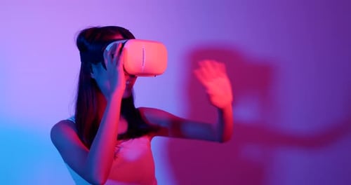 Woman Exploring Virtual Reality with VR Headset