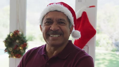 Smiling Senior Man in Santa Hat
