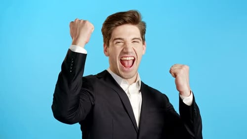 Excited Man Cheering in a Suit
