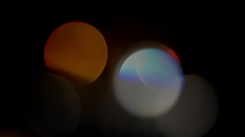 Colorful Light Flares on Black Background