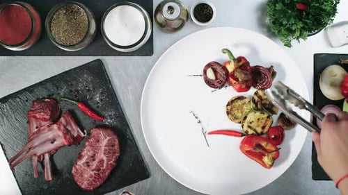 Chef Preparing Steak with Grilled Vegetables