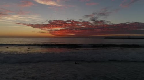 Surfers Surfing in Sea
