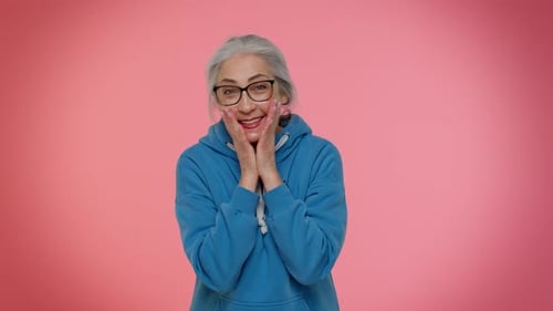 Senior Woman Waving and Expressing Happiness
