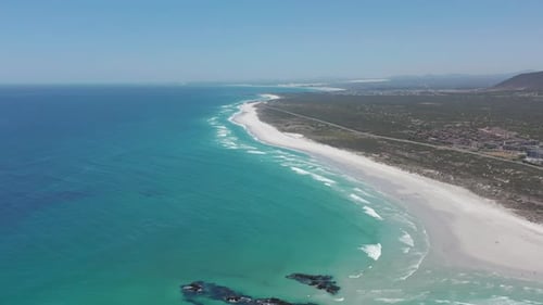 Aerial Moving Along the Shoreline of Big Bay Cape Town South Africa