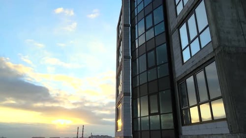 Aerial view of high residential apartment building under construction. Real estate development.