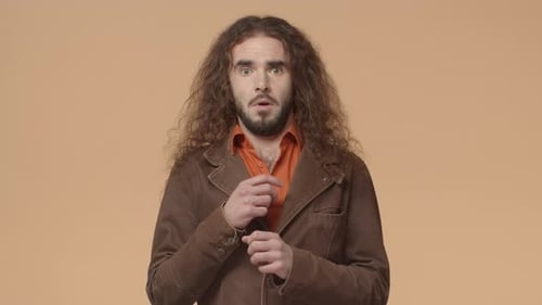 Surprised Man in Jacket Reacts to Something