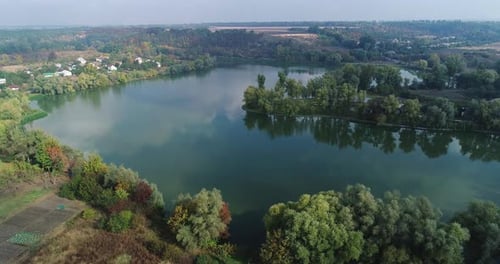 Beautiful view of the countryside, the camera flies over the lake