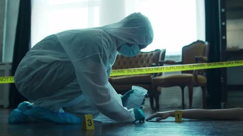 Crime Scene Investigator Collects Evidence Indoors