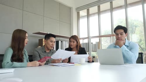 Team Meeting in Bright Modern Office