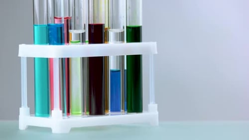 Adding Blue Liquid to Test Tube Rack