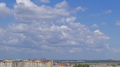 Daytime Clouds Over a Sunny Summer Town