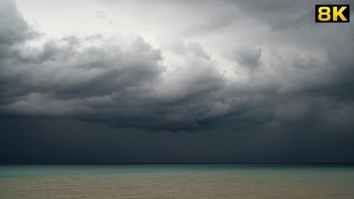 Storm Clouds and Rain at the Sea