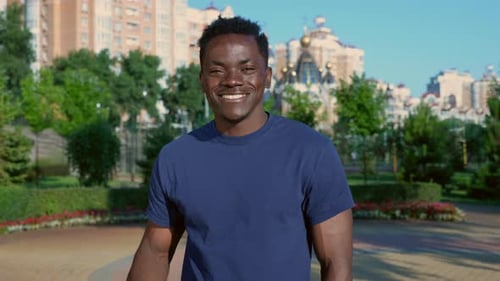 Smiling Man Shows Adhesive Bandage After Vaccination