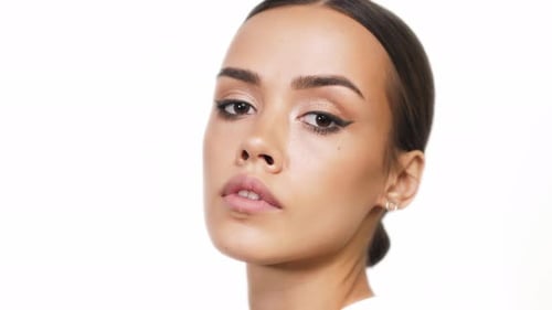 Close Up of Woman with Makeup Looking at Camera