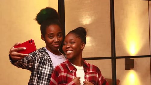 Portrait of Lovely Lesbian Couple Having Fun and Taking a Selfie