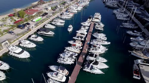 Drone Aerial of the Marina with Yachts Near the Mountains