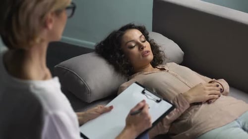 Woman in Therapy Session Lying on Couch