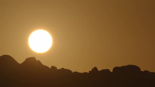 Warm Sunrise Over Dark Mountains