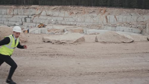 Group of Men Run at a Stone Quarry