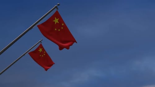 Waving Chinese Flag on Pole with Blue Sky Background