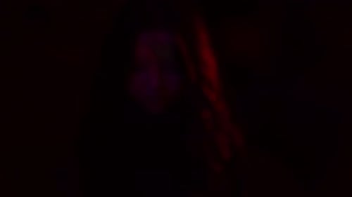 Close-up Portrait of Lovely Confident Girl with Stage Neon Make-up Looking at the Camera Going To