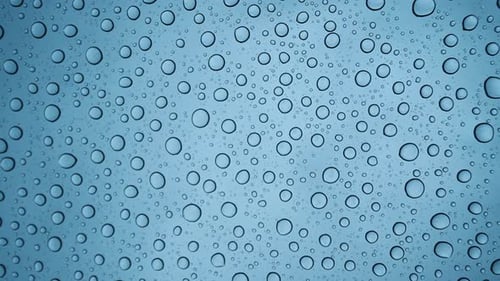 Water Droplets Forming Abstract Pattern on Surface