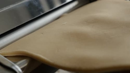 Manual machine and pasta close-up 4K 2160p 30fps UltraHD footage - Italian lasagne making from dough