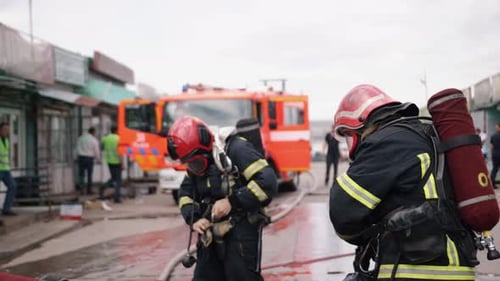 Firefighters Prepare for Emergency in Urban Setting