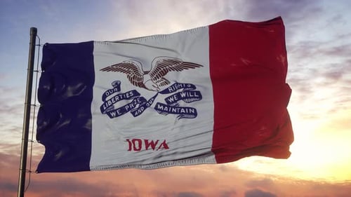 Iowa State Flag Waving Against Sunset Sky