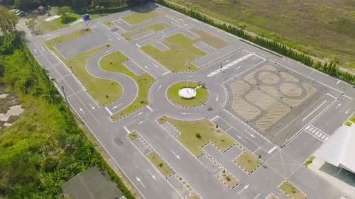 Aerial top view of a car driving test center with street road. Course field, practice vehicle school