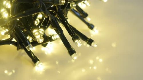 Blinking Christmas decoration close-up 4K 2160p 30fps UltraHD footage - String with sparkling fair
