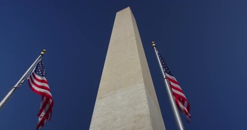Low Angle of Washington Monument with Flags