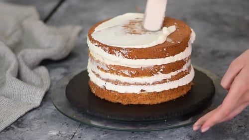 Pastry Chef Makes a Layered Cake with Prune and Whipping Cream