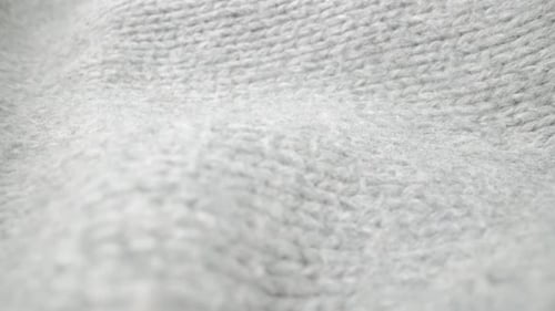 Extreme Detail View of Sheep Wool Cloth Texture Flowing in Macro Dolly Shot