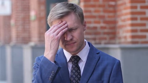 Headache Portrait of Tense Middle Aged Businessman in Office