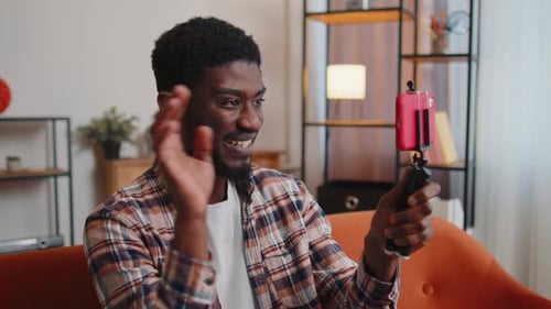 Man Blogger Influencer Taking Selfie on Smartphone Make Virtual Social Media Video Online at Home