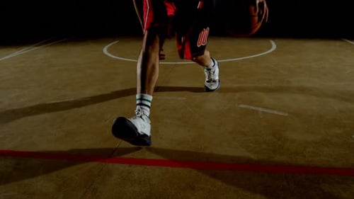 Basketball player playing basketball in the court 4k