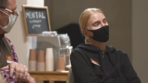 Woman Listening in Indoor Support Meeting